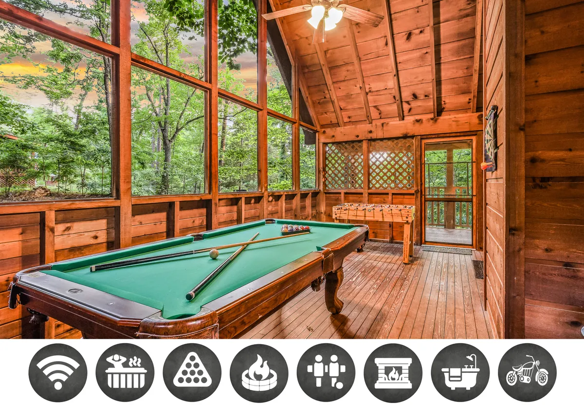 The image showcases a warm, wood-paneled cabin interior, centered around a pool table with inviting seating. Sunlight pours through expansive windows, revealing lush Smoky Mountain views and filling the space with a cozy glow. The setting exudes comfort and offers space for both relaxation and lively gatherings.